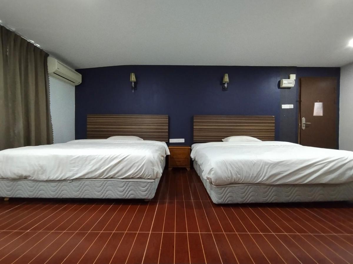 Oyo 90248 Kapitan Inn 民都鲁 外观 照片