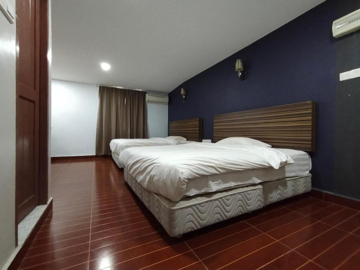 Oyo 90248 Kapitan Inn 民都鲁 外观 照片